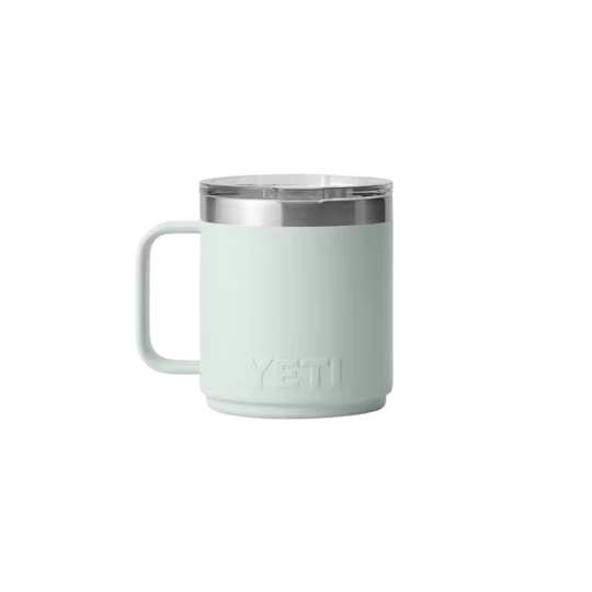 A pale mint green YETI insulated mug with a stainless steel rim and a matching handle, shown against a plain white background.