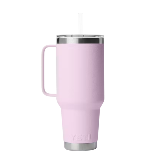 A light pink vacuum-insulated stainless steel tumbler with a handle, clear lid, and straw, shown on a plain white background.