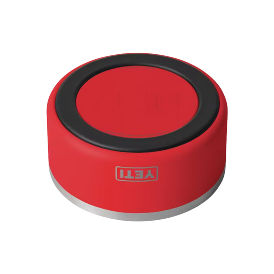 A red cylindrical Yeti brand cup holder with a black rubber gasket around the rim and a silver metal base, shown on a plain white background.
