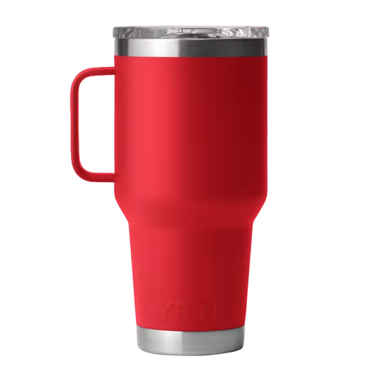 A red YETI insulated travel tumbler with a handle, a clear lid, and stainless steel accents, shown against a plain white background.
