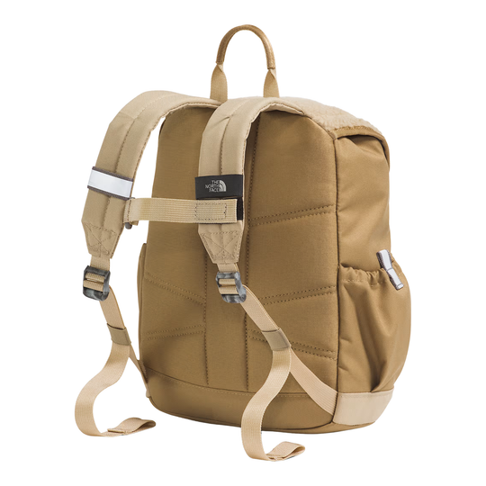 A tan canvas backpack shown from the back, featuring padded shoulder straps, adjustable buckled compression straps, a top carry handle, and a side pocket, photographed on a plain white background.