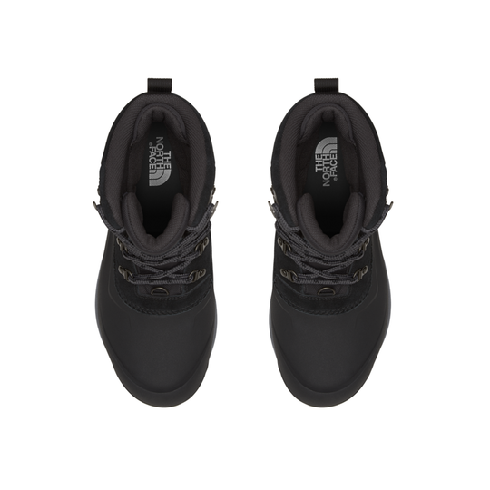 A pair of black ankle-height boots shown from a top-down view on a plain white background. The boots feature a matte black finish, lace-up front, and a visible white 'The North Face' logo printed inside the collar.