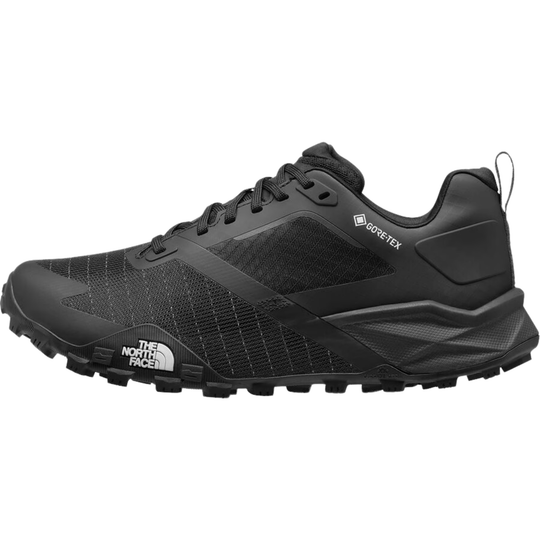 A black The North Face hiking shoe with a textured mesh upper, black laces, and a rugged black outsole, shown from a side profile on a white background.