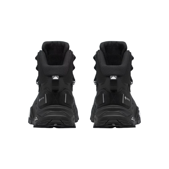 A pair of black mid-cut hiking boots shown from the back, featuring textured synthetic and mesh uppers, padded collars, and thick black lugged soles, set against a plain white background.