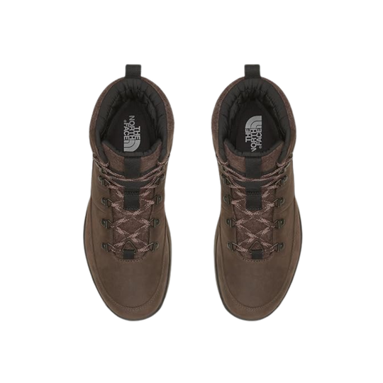 A pair of brown low-top hiking boots shown from a top-down view on a plain white background. The boots feature brown laces, black pull tabs, and a black interior lining with the white 'The North Face' logo visible on the insoles.