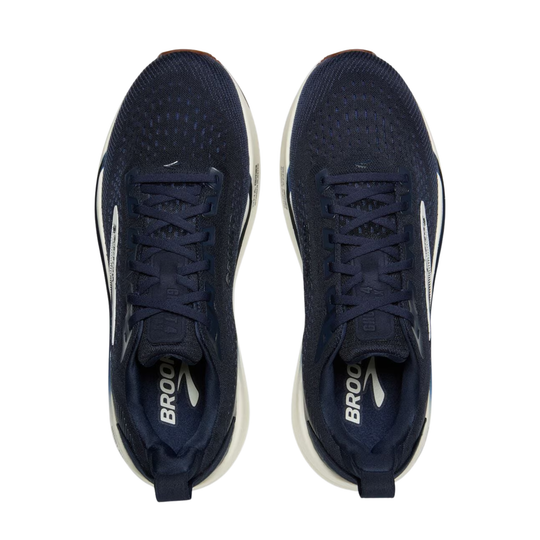 A pair of navy blue athletic sneakers shown from a top-down view on a plain white background. The shoes feature a textured knit upper, navy laces, and a thick white midsole with the brand name 'BROOK' printed in white on the inner heel area.