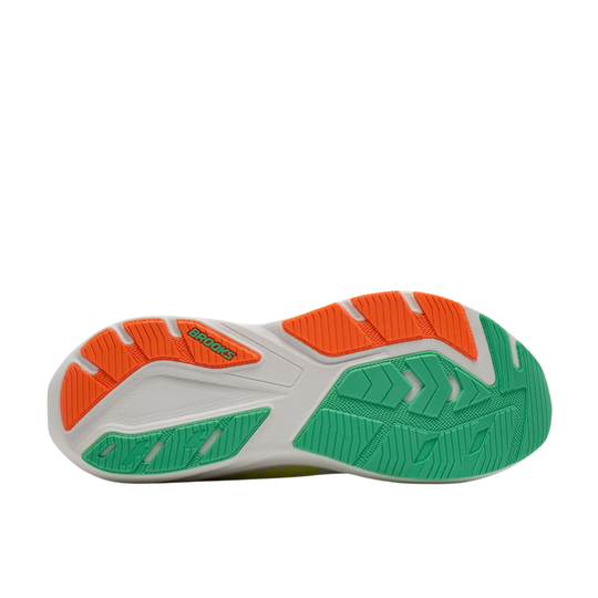 The outsole of a Brooks running shoe, showing a white base with bright green and orange tread patterns, on a solid white background.