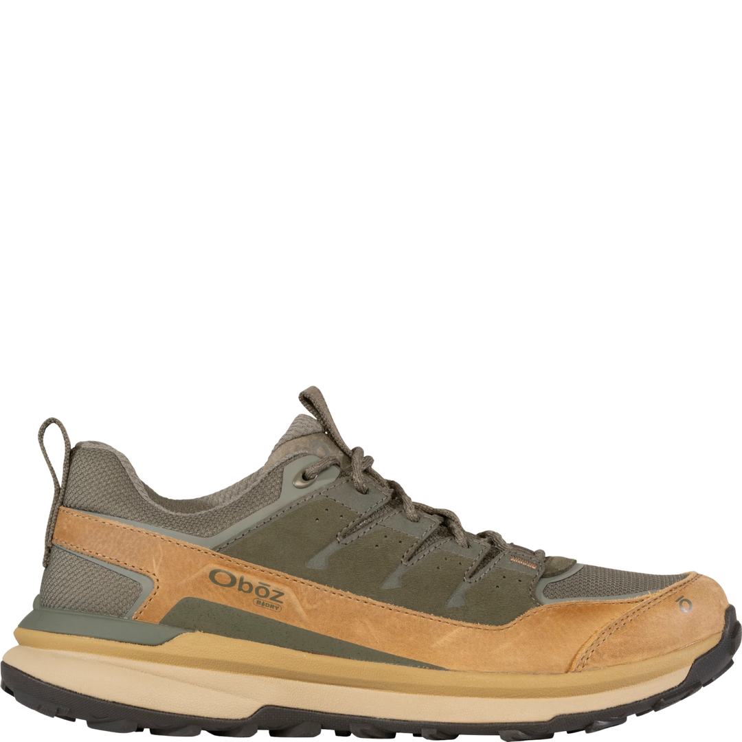 Brown and green hiking shoe with 'Oboz' branding on a white background