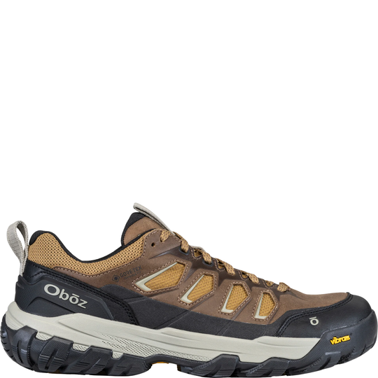 Brown hiking shoe with visible Oboz branding on a white background