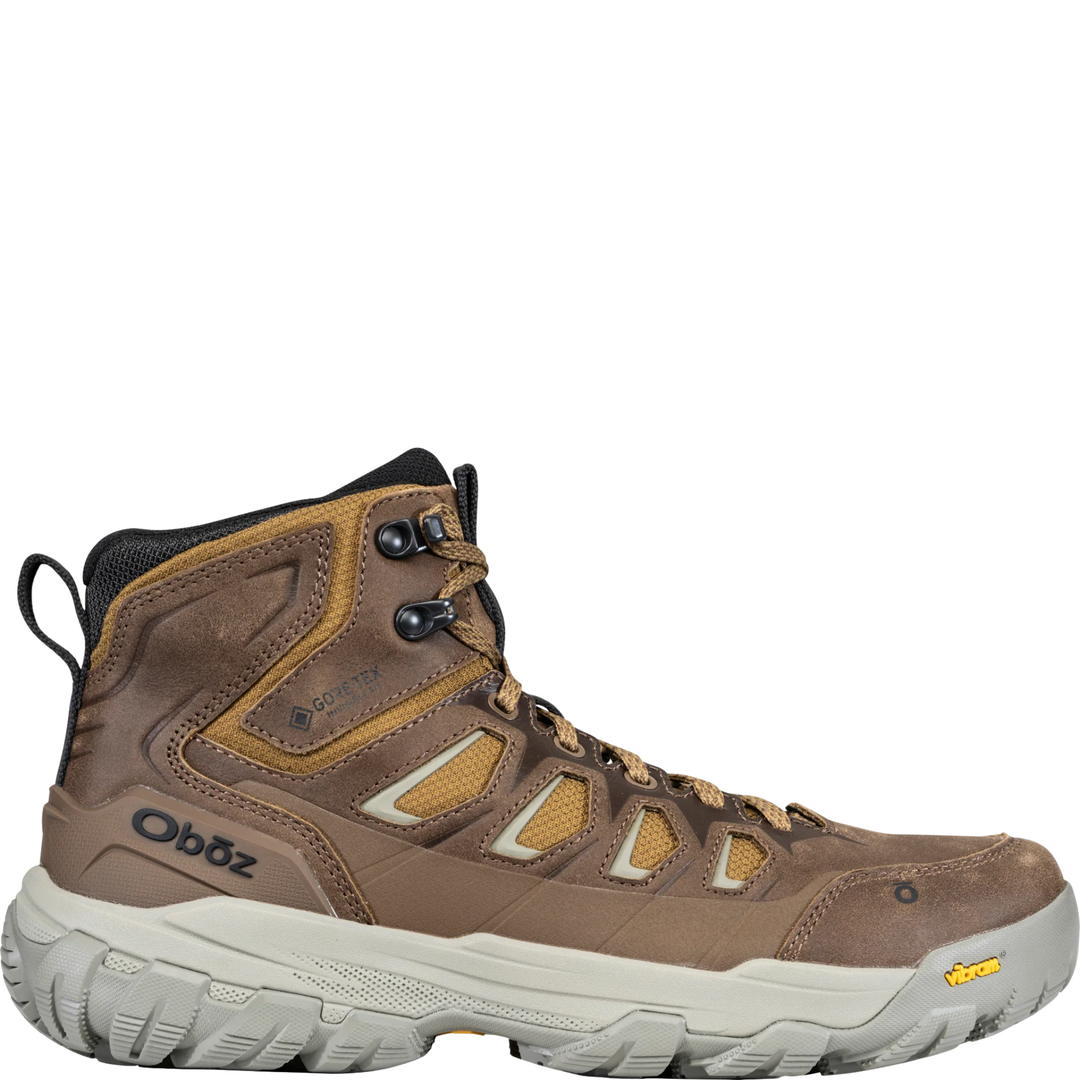 Brown hiking boot with visible brand logo on a white background