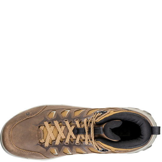A top-down view of a brown leather hiking boot with tan laces and a black interior, shown against a plain white background.