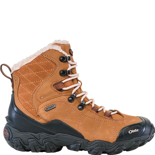 A single Oofz mid-height hiking boot in tan suede and synthetic fabric, featuring a black rubber sole, black laces with metal eyelets, and a white sherpa lining visible at the collar, set against a plain white background.