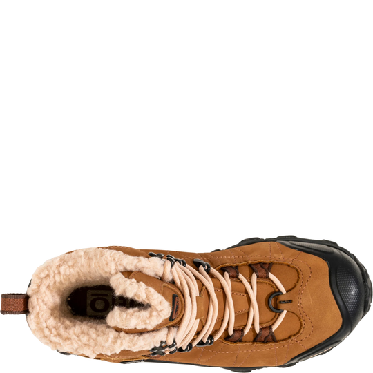 Brown winter boot with white fur lining on a white background