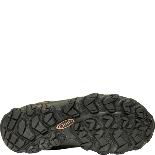 Close-up of a hiking shoe sole with brand logo on a white background