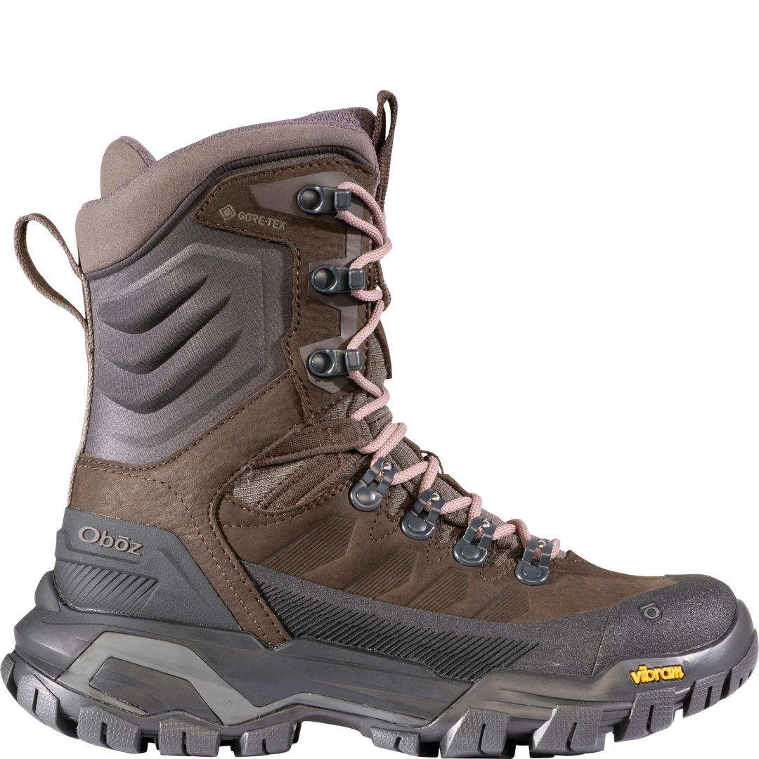 Brown and gray hiking boot with visible brand logos on a white background