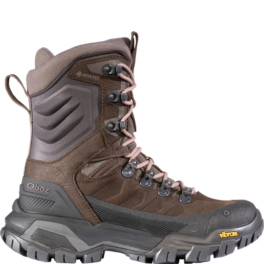 Brown and gray hiking boot with visible brand logos on a white background