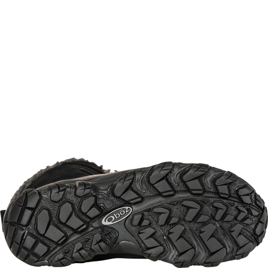 Black hiking shoe sole with brand logo on a white background