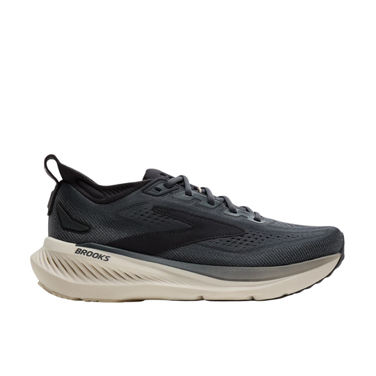Brooks running shoe in dark gray and black with a thick beige midsole, shown from the side on a white background.