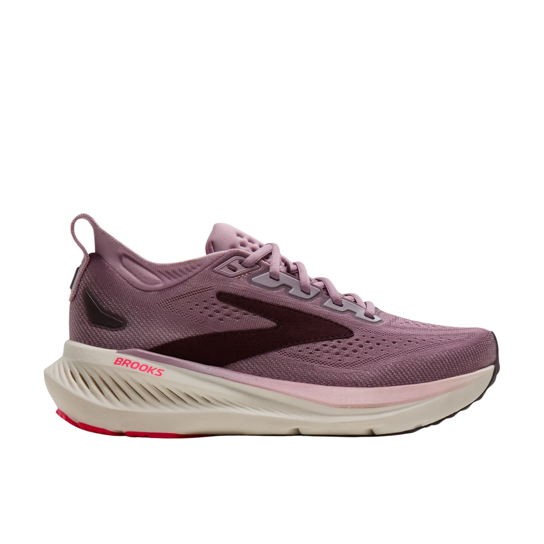 A Brooks running shoe in a dusty mauve-purple colorway, featuring a dark burgundy logo stripe, a cream-colored midsole, and a small red accent on the outsole.
