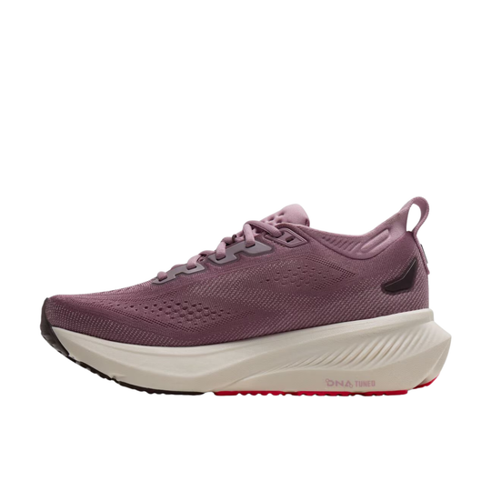 A single running shoe in a dusty mauve-purple color, featuring a thick white midsole with a red accent line and black outsole, shown against a plain white background.