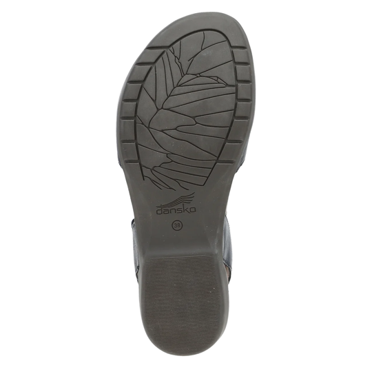 The outsole of a dark gray shoe, showing a leaf-like tread pattern and the 'danska' brand name printed near the heel, on a solid white background.