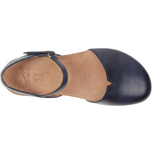 A single women's Mary Jane flat shoe shown from a top-down view. The shoe features a navy blue leather toe cap and ankle strap with a small gold buckle, a light brown suede insole, and a matching light brown footbed.