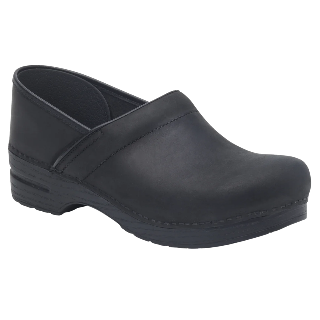 A single black slip-on clog shoe with a low wedge heel, shown from a three-quarters angle on a plain white background.