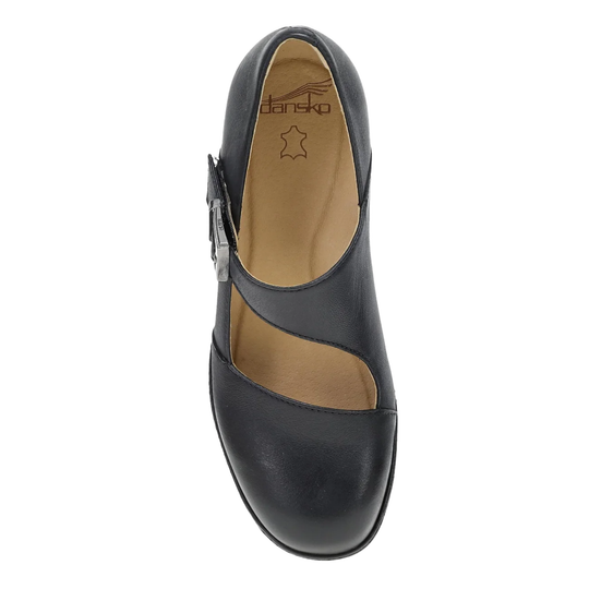 A single black leather Mary Jane shoe shown from a top-down view, featuring a decorative silver buckle on the side and a tan insole with the 'dansk' brand logo visible.
