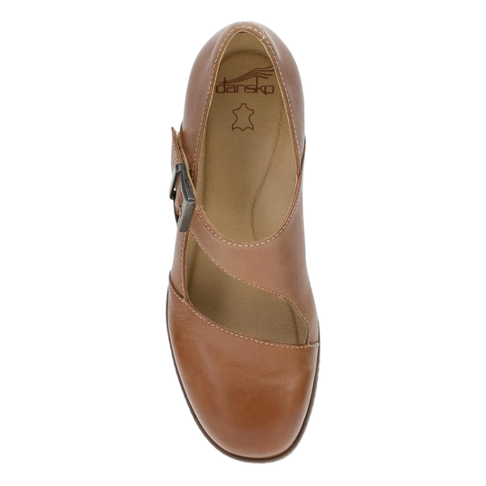 A single women's Mary Jane style shoe in tan leather, shown from a top-down view against a plain white background. The shoe features a closed toe, a side buckle strap, and the 'darsko' brand name printed on the insole.