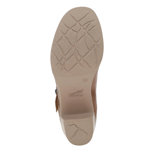 Top-down view of a shoe sole in beige, showing a textured tread pattern and embossed branding near the heel.