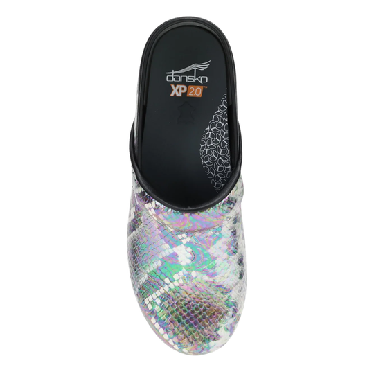 A single women's clog-style slipper shown from a top-down view on a white background. The upper is covered in iridescent holographic snakeskin-like scales, while the inner sole and heel area are black with the 'dansk' and 'XP 20' branding visible.