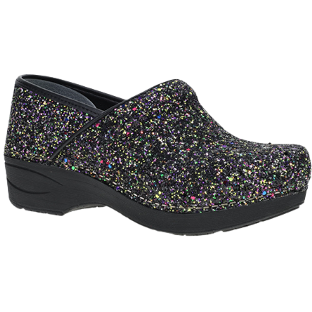 A single women's clog shoe covered in black glitter with iridescent multicolor flecks, featuring a black wedge sole, shown against a plain white background.