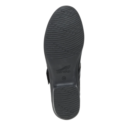 Black shoe sole with 'Dansko' branding on a white background