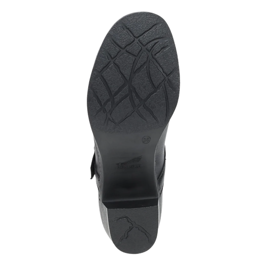Black shoe sole with Dansko logo on it on a plain white backrground