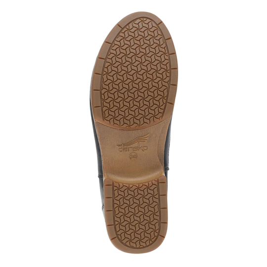 Close-up of a shoe sole with a brand logo on a white background