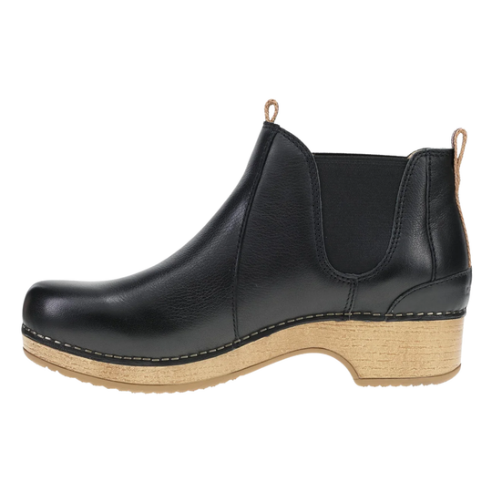 A black leather Chelsea-style ankle boot with a natural wood wedge heel and pull tabs, shown from a side profile view on a white background.
