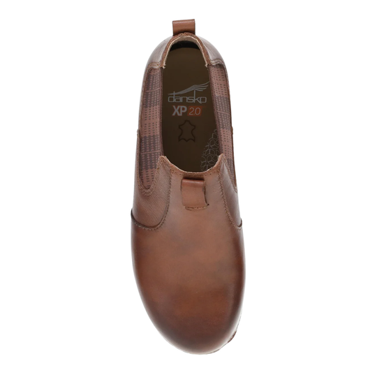 Brown slip-on shoe with 'Dansko' branding on a white background