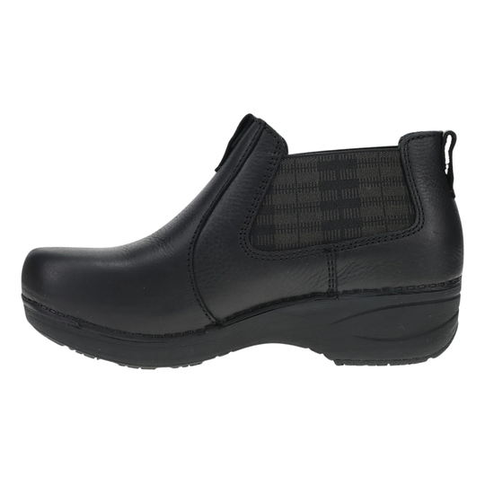 A black slip-on ankle boot with a textured elastic side panel and a thick black platform sole, shown from a side profile view on a white background.