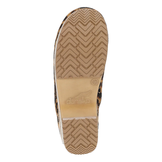 The outsole of a shoe with a brown and black leopard print pattern and a tan central section embossed with the brand name 'dansko'.