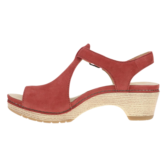 Red sandal with a wedge heel on a white background