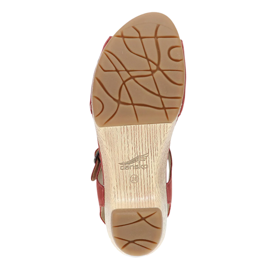 Close-up of a shoe sole with a brand logo on a white background