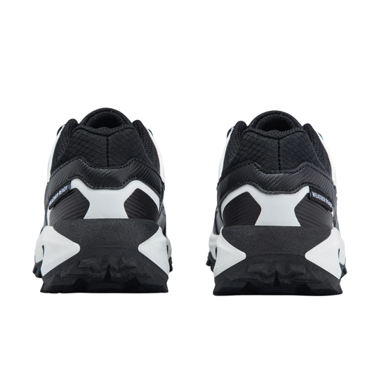 Black and white trail running shoes shown from the rear, featuring a chunky black and white sole and textured black mesh uppers.