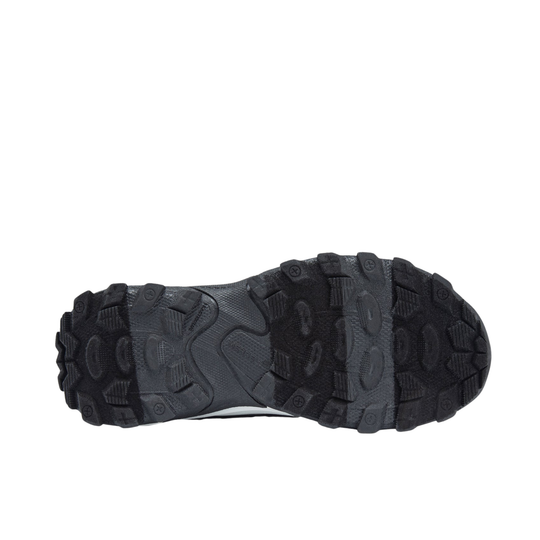 A top-down view of a black and dark gray rugged outdoor shoe sole, showing the deep lugs and tread pattern, on a solid white background.
