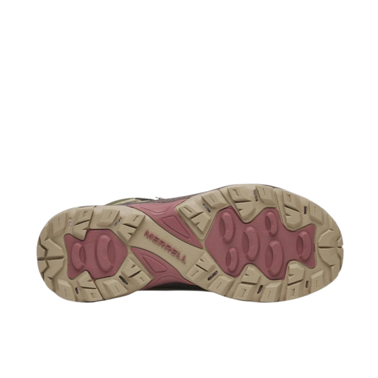 A top-down view of a hiking shoe's sole, featuring a beige rubber outsole with a dusty rose pink tread pattern and the brand name 'MERRILL' embossed in the center.