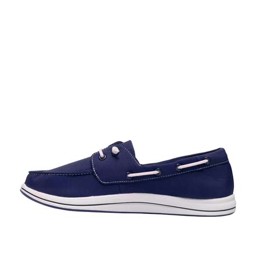 A single navy blue boat shoe with white accents, including a white sole and decorative white eyelets, shown in a side profile on a white background.