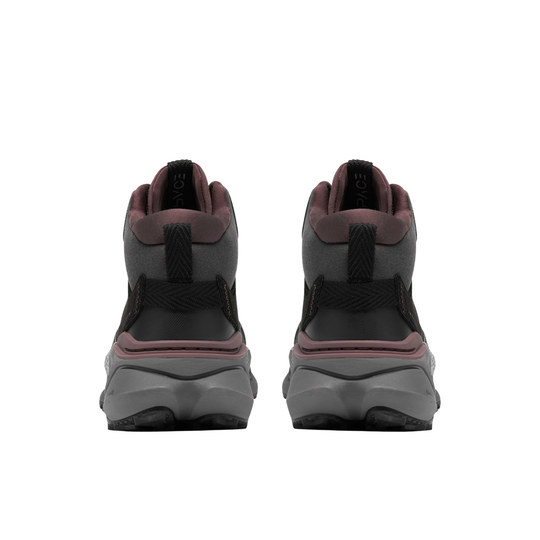 A pair of black mid-top athletic sneakers with gray and white braided laces, shown from back of heel with black thumb loops on a white background.