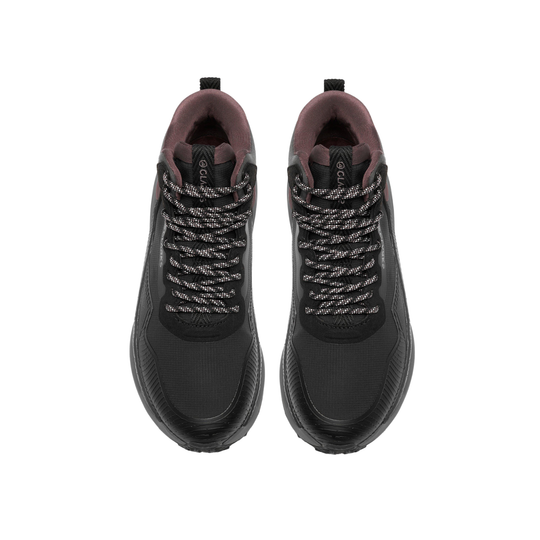 A pair of black mid-top athletic sneakers with gray and white braided laces, shown from a top-down view on a white background.