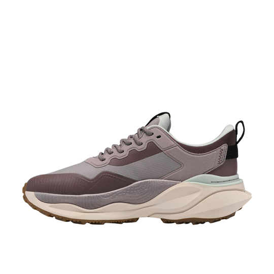 mauve sneaker with white sole on a light gray background