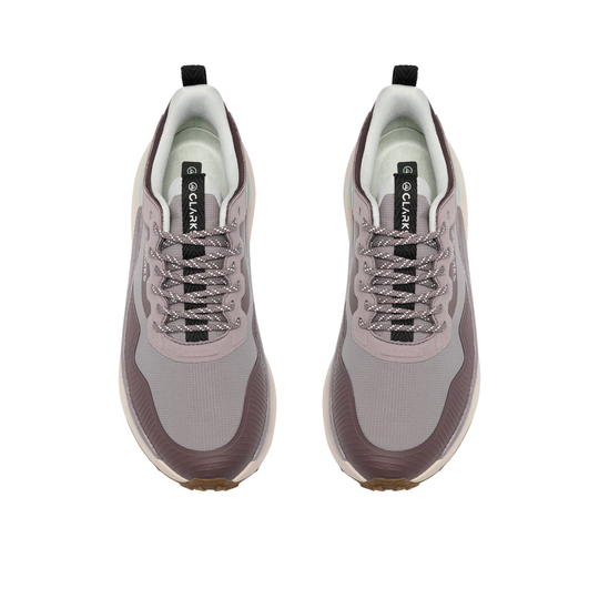 A pair of CLARK brand athletic sneakers shown from a top-down view on a solid white background. The shoes feature a color-blocked design in shades of dusty lavender, taupe-brown, and light gray, with gray laces and black pull tabs.
