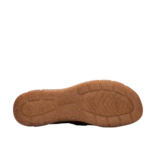 The brown textured rubber outsole of a shoe, photographed from a direct bottom angle against a solid white background.